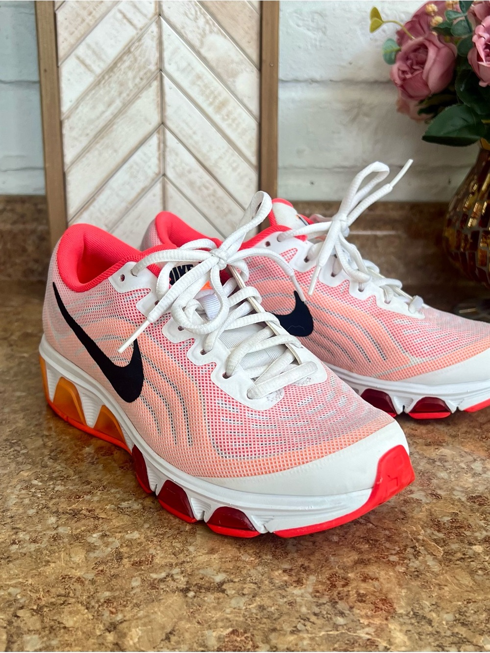 Nike Women's Coral/Pink Athletic Running Shoes with Black Swoosh